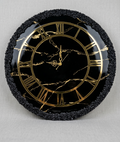 Black and gold resin clock